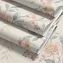 Pink chinoiserie wallpaper with watercolor flowers, blue-grey leaves and red berries on a cream linen-texture ground
