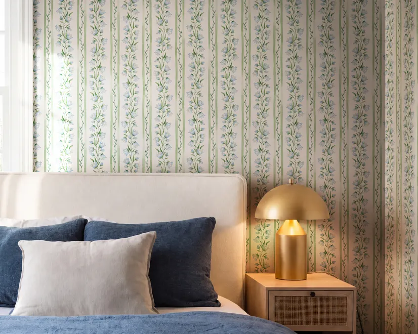 Blue floral stripe wallpaper with pale sky-blue bell flowers, green vines and sage bands on white