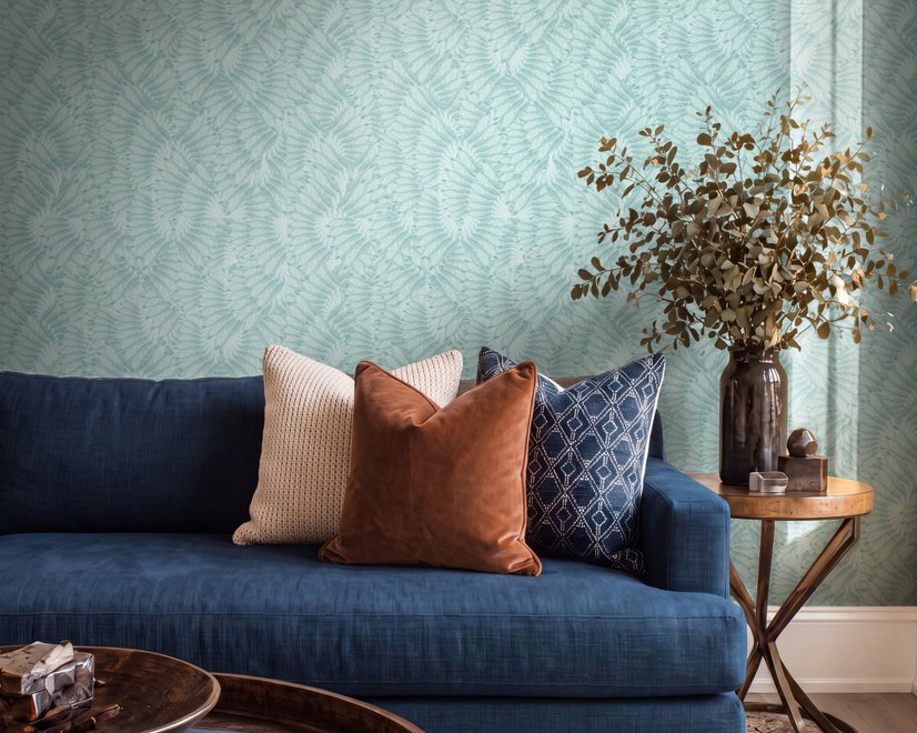 Aqua fern wallpaper with overlapping icy blue palm fronds on a pale aqua ground