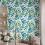 Dark olive green wallpaper with teal and cobalt watercolour lance leaves on a white ground
