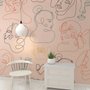 Papier peint panoramique abstrait de visages roses