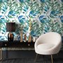 Dark olive green wallpaper with teal and cobalt watercolour lance leaves on a white ground