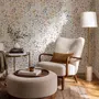 Watercolour wildflower wallpaper with pastel flowers and sage leaves on a white ground