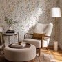 Watercolour wildflower wallpaper with pastel flowers and sage leaves on a white ground