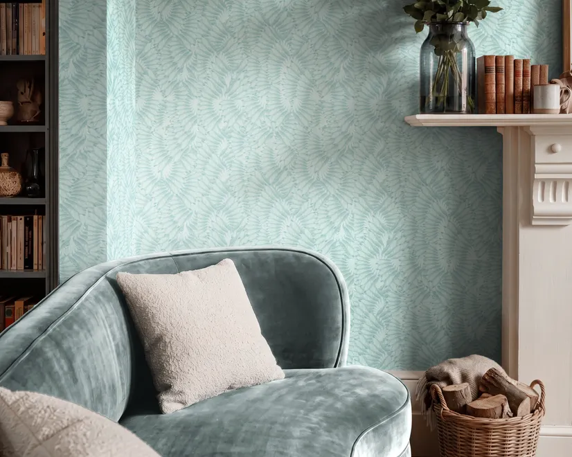 Aqua fern wallpaper with overlapping icy blue palm fronds on a pale aqua ground