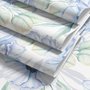 Blue floral wallpaper with watercolour anemone blooms, mint sage leaves and yellow ochre centres on white