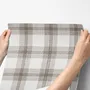 Neutral beige and brown plaid wallpaper with cream squares, taupe woven blocks and fine dark brown lines