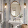 Blue wallpaper with indigo botanical stripework, pinstripes and dotted borders on warm cream parchment