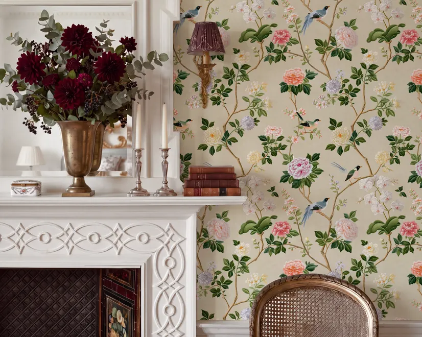 Chinoiserie wallpaper with blue-grey birds, pink peonies, white orchids and green branches on ivory-cream ground