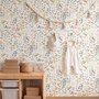 Watercolour wildflower wallpaper with pastel flowers and sage leaves on a white ground