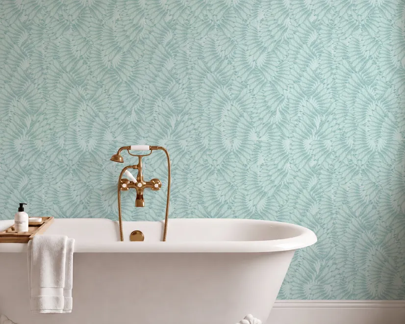 Aqua fern wallpaper with overlapping icy blue palm fronds on a pale aqua ground
