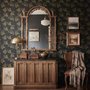 Black wallpaper with antique metallic gold ginkgo leaves on a mottled charcoal ground