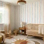 Blue and light blue wallpaper with hand-painted vertical watercolour stripes on a clean white ground