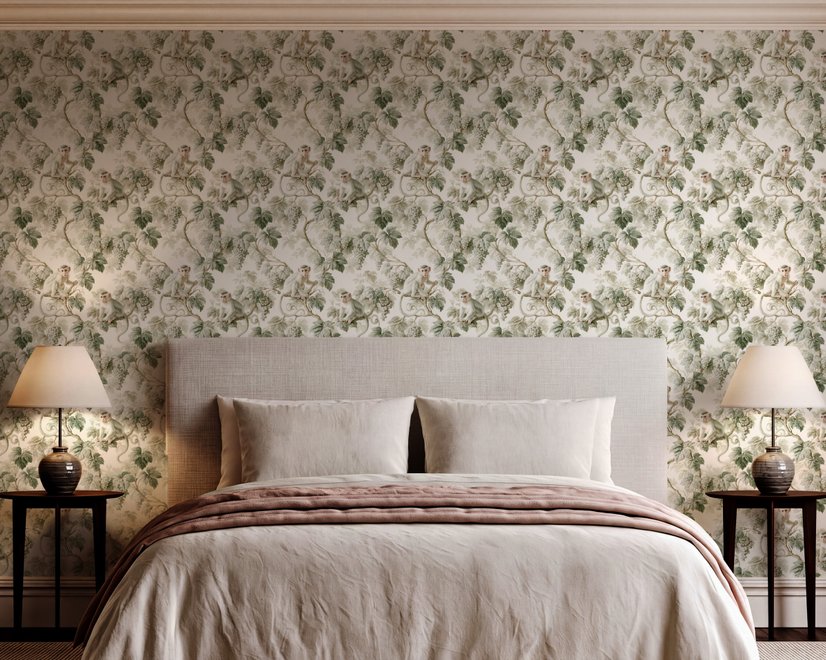 Vintage nature wallpaper with pale monkeys, sage grape leaves, white grape clusters and taupe vines on ivory.
