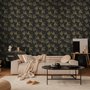 Black wallpaper with antique metallic gold ginkgo leaves on a mottled charcoal ground
