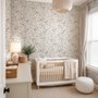 Black outline botanical wallpaper with charcoal wildflowers and grasses on a warm ivory cream ground