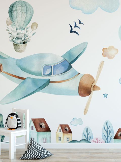 Papier peint village de dessins animés et avion en aquarelle