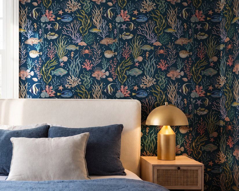 Aquarium fish tank wallpaper repeat with tropical fish, coral, seaweed, shells and bubbles on deep navy blue