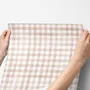 Soft brown wallpaper with pale beige gingham checks on a warm cream off-white ground