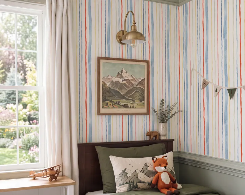 Blue and light blue wallpaper with hand-painted vertical watercolour stripes on a clean white ground