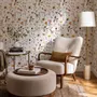 Cute spring wallpaper with pressed ivory, pink, blue and yellow wildflowers on a white ground