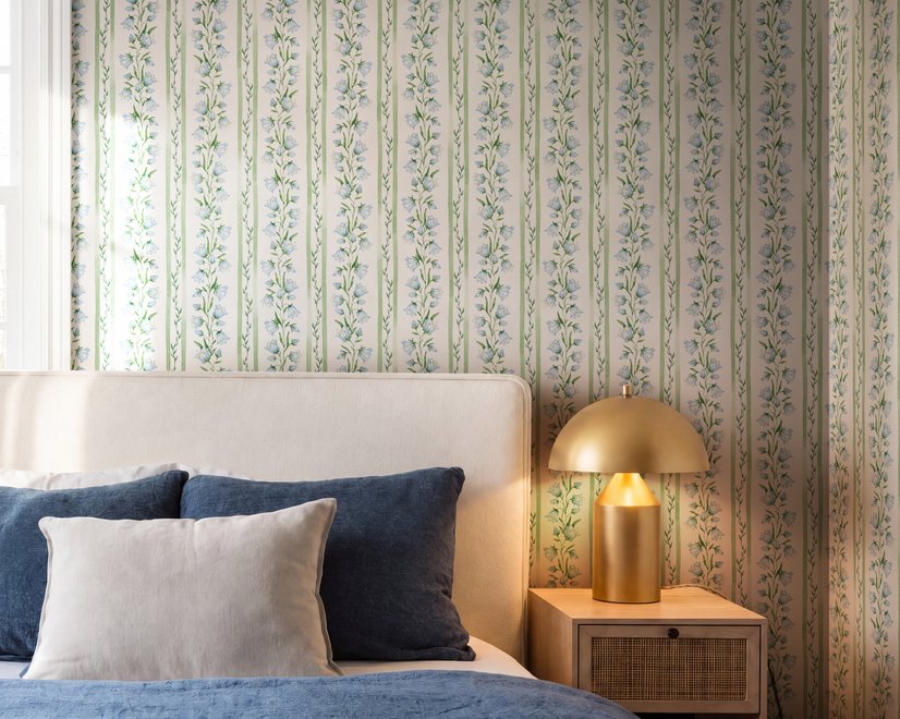 Blue floral stripe wallpaper with pale sky-blue bell flowers, green vines and sage bands on white