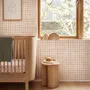 Soft brown wallpaper with pale beige gingham checks on a warm cream off-white ground