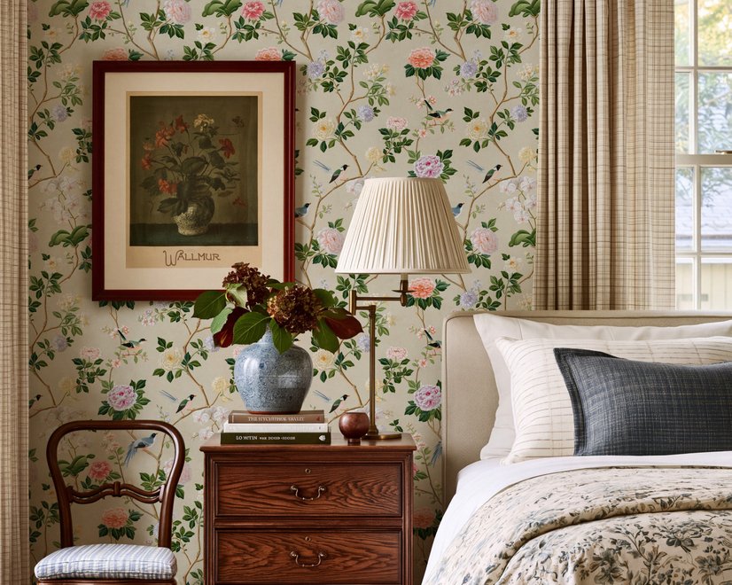 Chinoiserie wallpaper with blue-grey birds, pink peonies, white orchids and green branches on ivory-cream ground