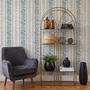 Blue wallpaper with indigo botanical stripework, pinstripes and dotted borders on warm cream parchment