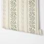 Green aesthetic wallpaper with sage leafy sprigs, fine vertical rules and dotted borders on cream ivory