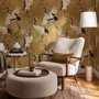 Japanese crane wallpaper with white, black and red cranes in flight on an antique-gold textured ground
