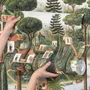 Architectural design wallpaper mural of forest treehouses, rivers, boats and small figures in green watercolour