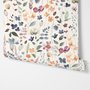 Watercolour floral wallpaper repeat with navy, blue, blush and peach wildflowers on warm cream