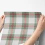 Sage green and cream-white tartan plaid wallpaper with deep red stripes and woven thread texture