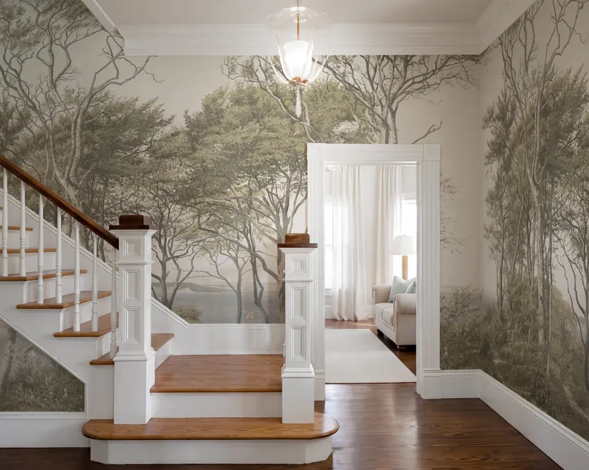 Tree wallpaper forest mural with olive coastal woodland, bare branches, shoreline path and small sailboats