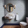 Cream colored wallpaper with denim blue geometric totem stripe repeat on a linen texture ground
