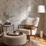 Black outline botanical wallpaper with charcoal wildflowers and grasses on a warm ivory cream ground