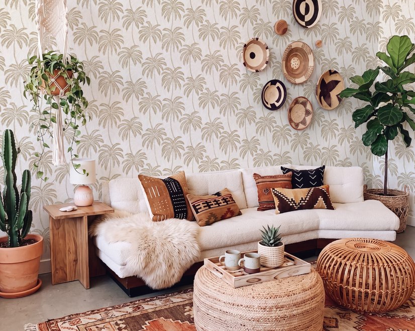 Muted sandy taupe palm trees and pale foliage on a creamy ivory ground tropical wallpaper