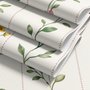 Cute floral wallpaper with green vine trails and pink, purple and yellow watercolor flowers on cream