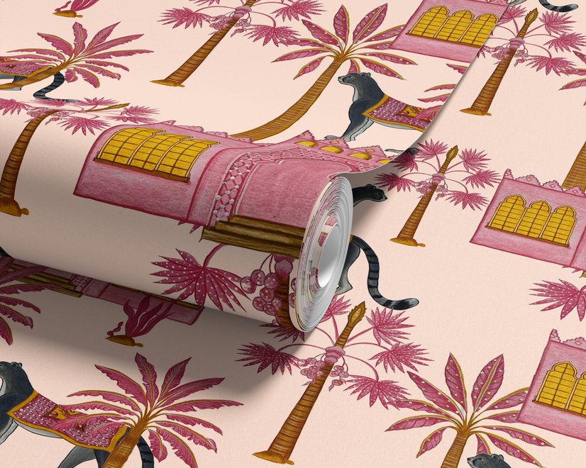 Tropical foliage wallpaper with black panthers, pink palace facades and ochre palms on pale peach