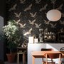 Ivory cranes and antique gold lotus flowers on charcoal-black Japanese lotus wallpaper