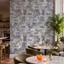 Jungle wallpaper with animals in navy toile, showing tigers, elephants and monkeys on an ivory cream ground