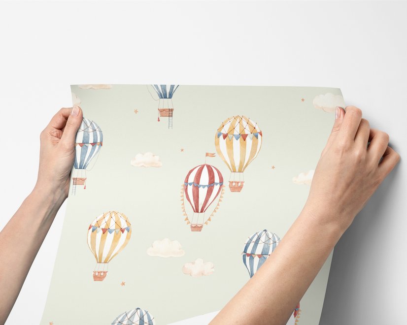 Watercolor blue wallpaper with hot air balloons, cream clouds and peach stars on pale sage green