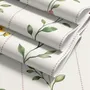 Cute floral wallpaper with green vine trails and pink, purple and yellow watercolor flowers on cream