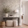 Black outline botanical wallpaper with charcoal wildflowers and grasses on a warm ivory cream ground