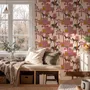 Tropical foliage wallpaper with black panthers, pink palace facades and ochre palms on pale peach