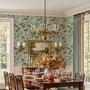 Celadon-sage chinoiserie wallpaper with blue-grey birds, tan branches, pink peonies and white orchids