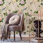 Chinoiserie wallpaper with blue-grey birds, pink peonies, white orchids and green branches on ivory-cream ground