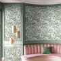 Sage green botanical floral wallpaper with white poppy flowers, lobed leaves and dotted seed centres