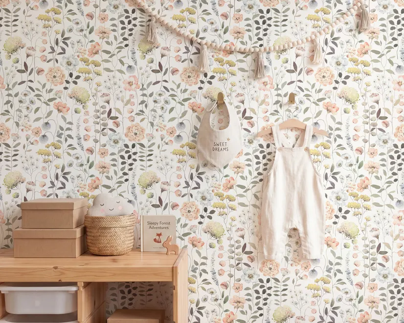 Watercolour wildflower wallpaper with pastel flowers and sage leaves on a white ground
